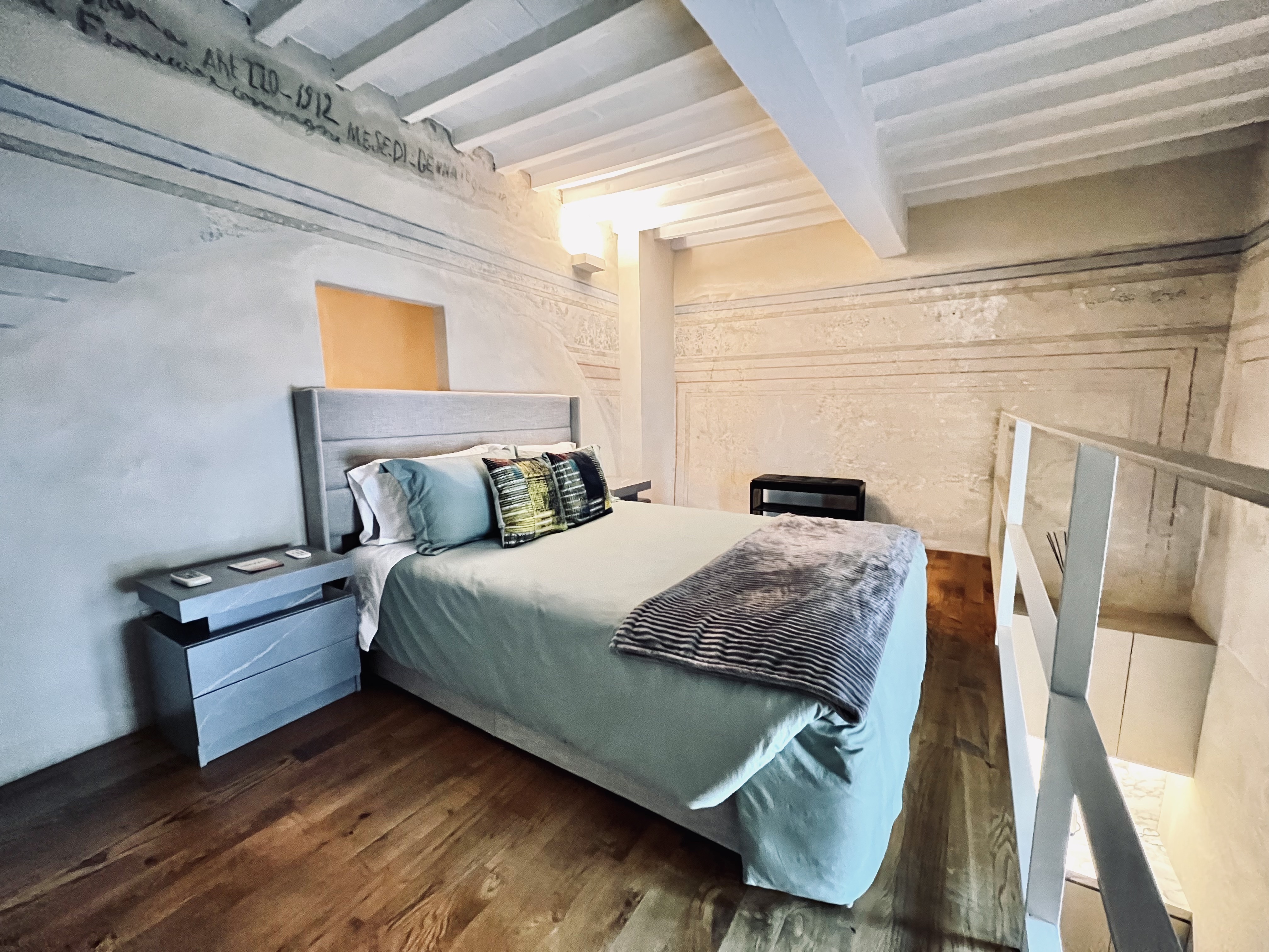 Upstairs bedroom with exposed beams